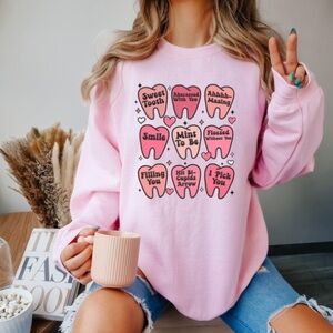 Pink Graphic Women's Sweater “Dentistry” Baby Pink Size Medium
